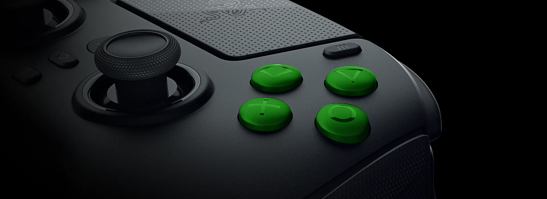 Close-up of a gaming controller with black body and bright green buttons labeled with directional arrows, plus, and a circular button.