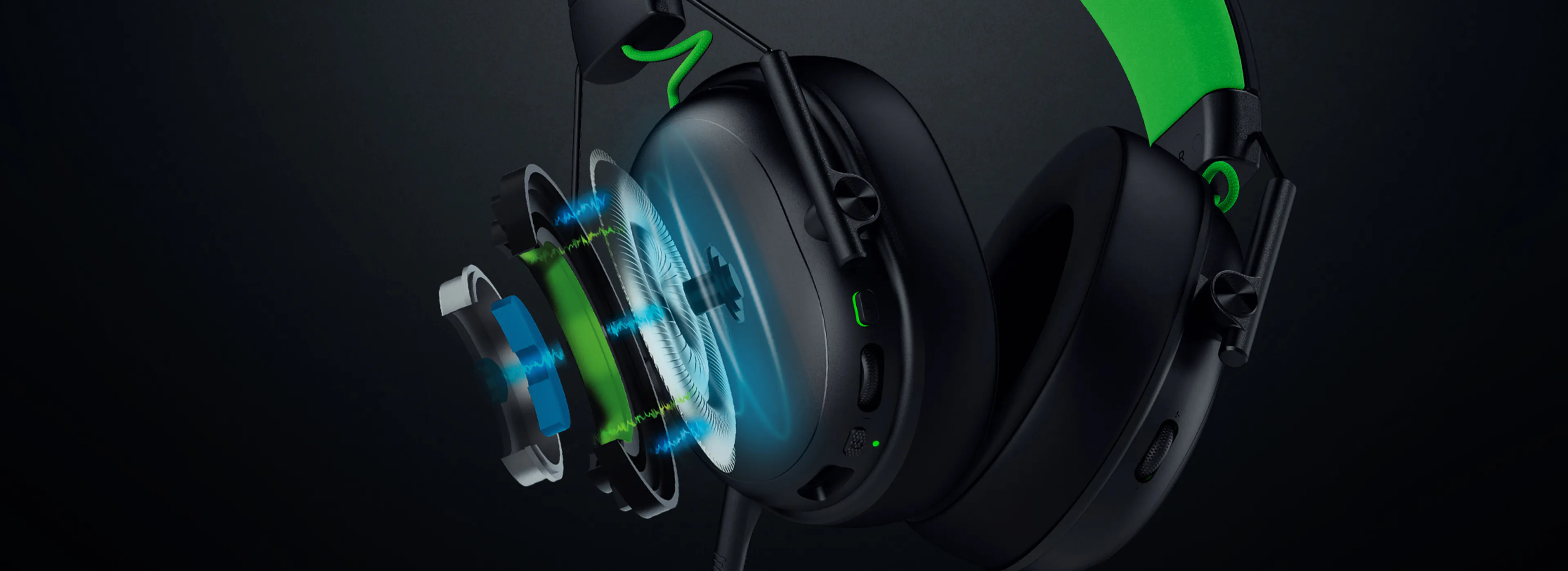 Cutaway of a headset showing internal components, including speakers, wiring, and sound waves, with some parts highlighted in blue, green, and white.