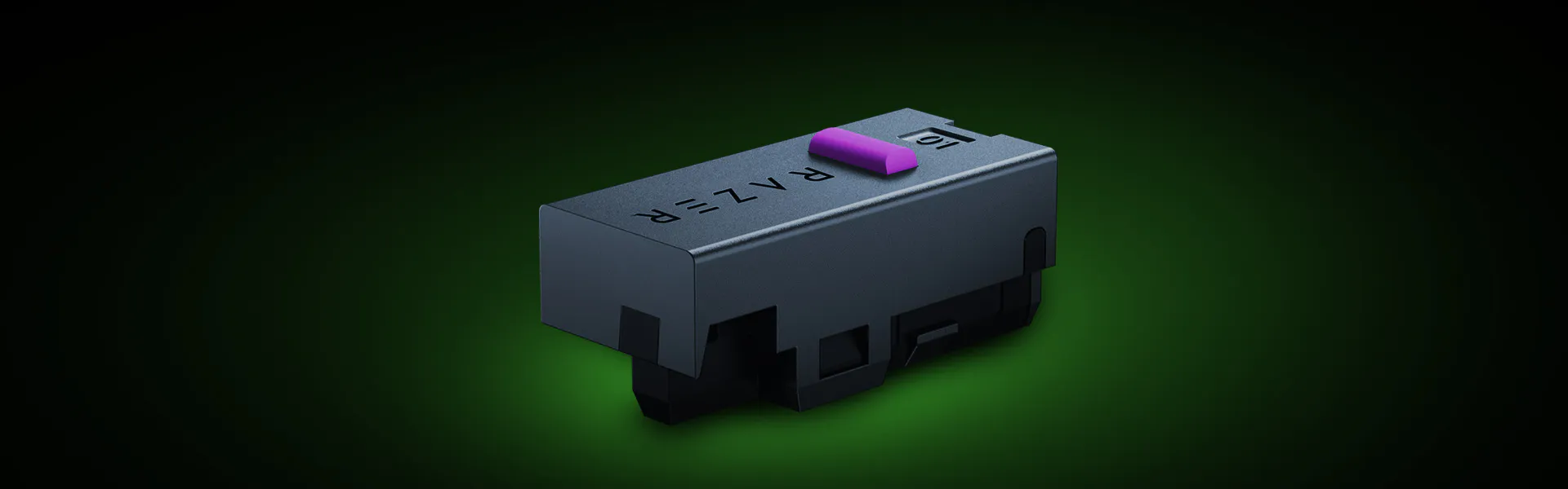 A close-up of a black laser toner cartridge with "R-ALF" and a purple tab, set against a dark gradient background.