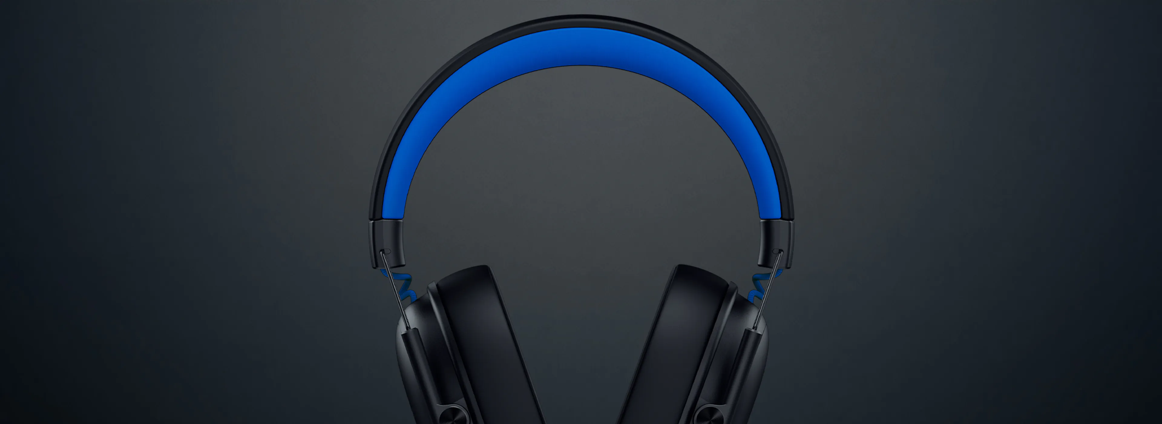 Wireless black headphones with a blue inner headband and sleek design, set against a dark gradient background.