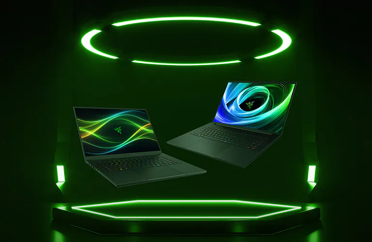 Two Razer laptops display colorful wave screens, floating inside a green neon-lit circular and hexagonal frame on a dark background.