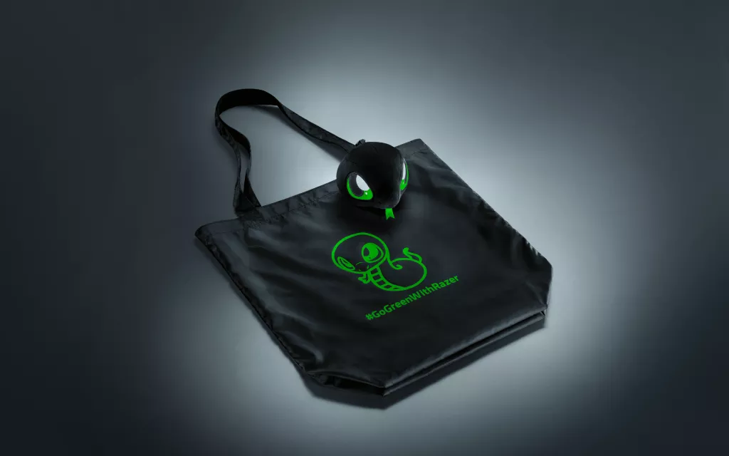 Back and Greener Than Ever: Sneki Snek Returns with a Planet-Friendly Twist Sneki Snek plush bag charm with the unfolded Razer Sneki Snek Reusable Bag displayed side by side.