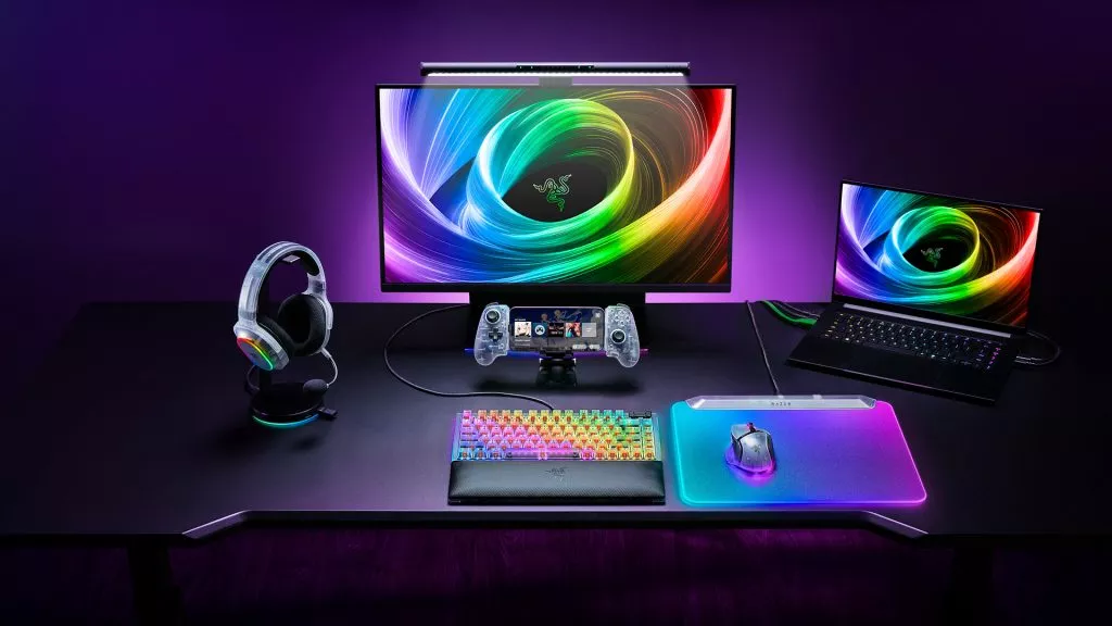 Razer Phantom White Collection displayed on a clean gaming desk in a vibrant Razer Chroma RGB-lit environment.