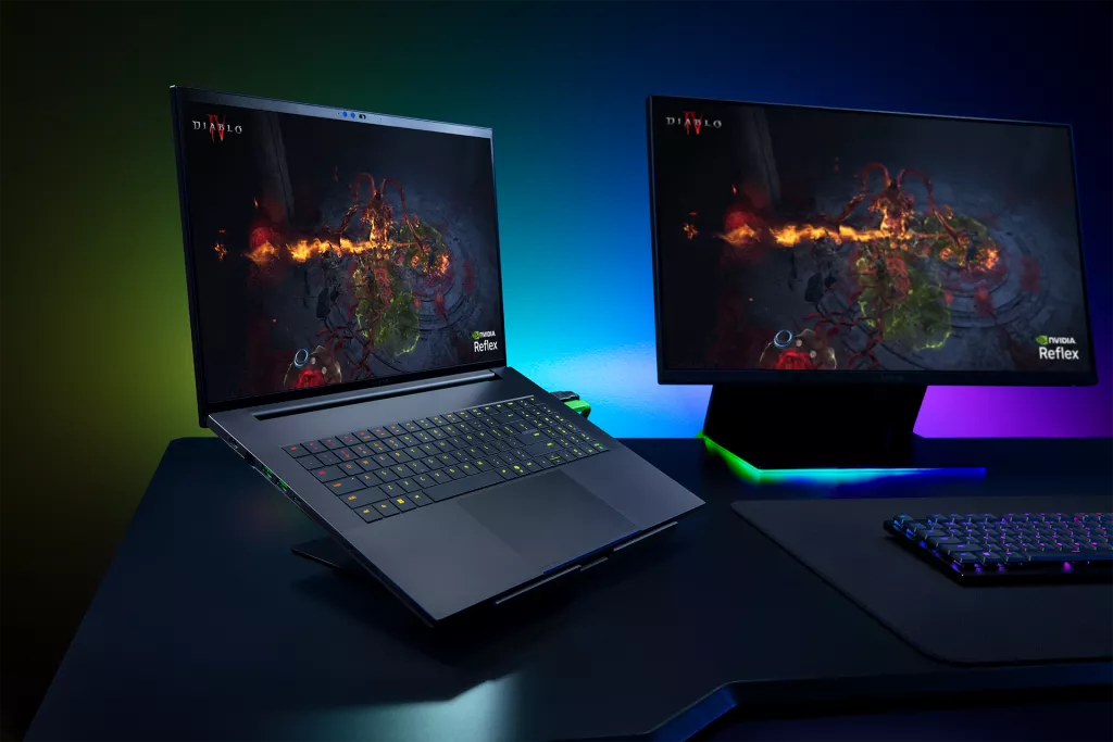 Razer Blade laptop connected to an external monitor, showcasing a gaming setup designed for high-performance play.