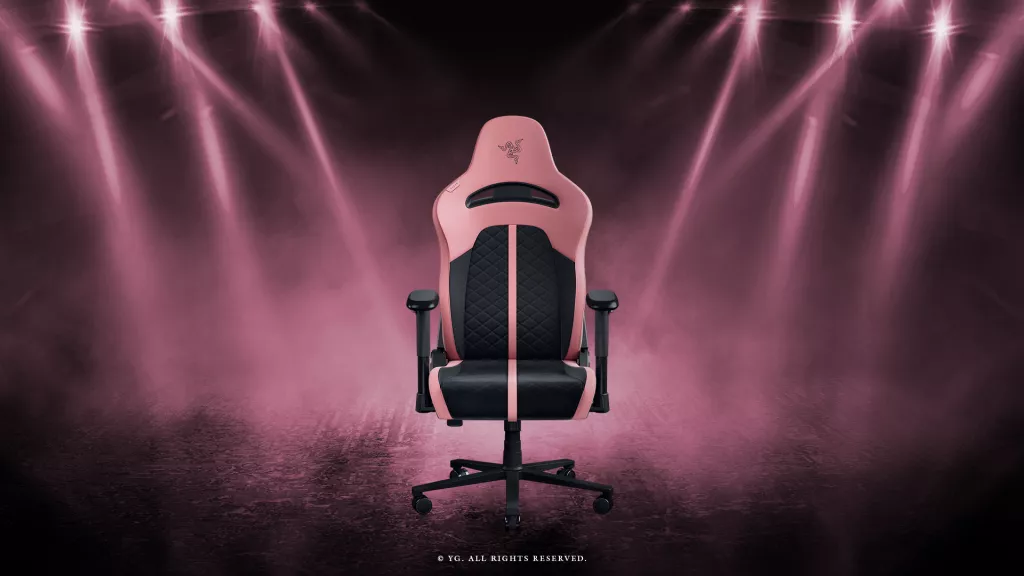 Razer Enki X – BLACKPINK Edition gaming chair in pink and black, shown under stage lighting inspired by the BLACKPINK World Tour .