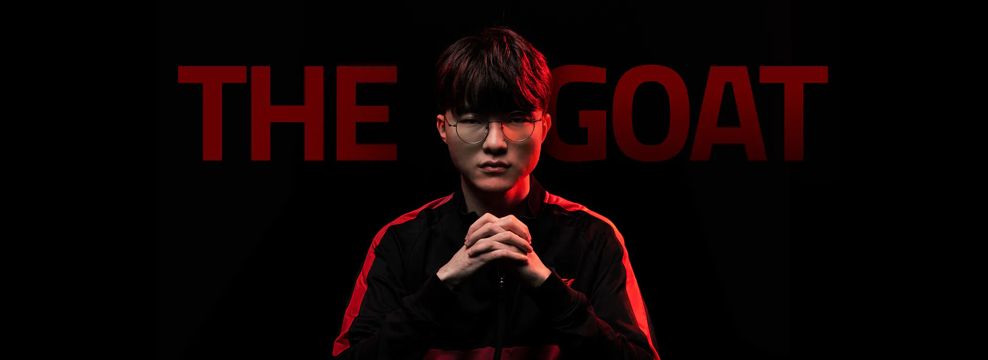 Image of Faker with the text “The GOAT” in the background.