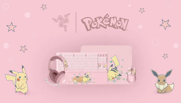 Pink Pokémon-themed workspace with Pikachu, Eevee, headphones, keyboard, mouse, and mouse pad on a pastel pink background.