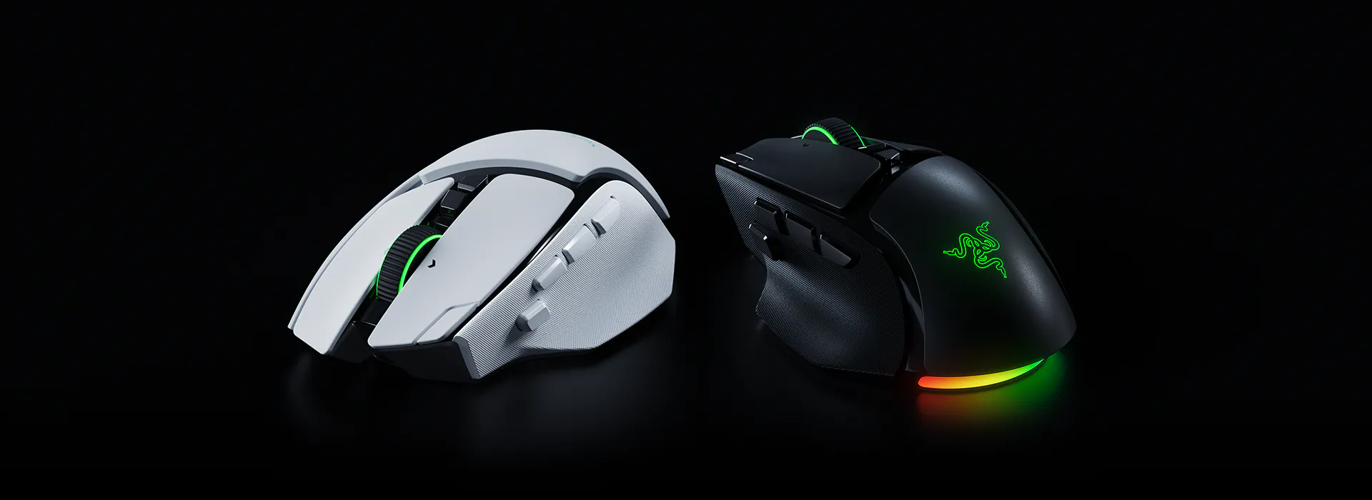Two gaming mice, one white with gray accents and one black with green lighting, on a black background.