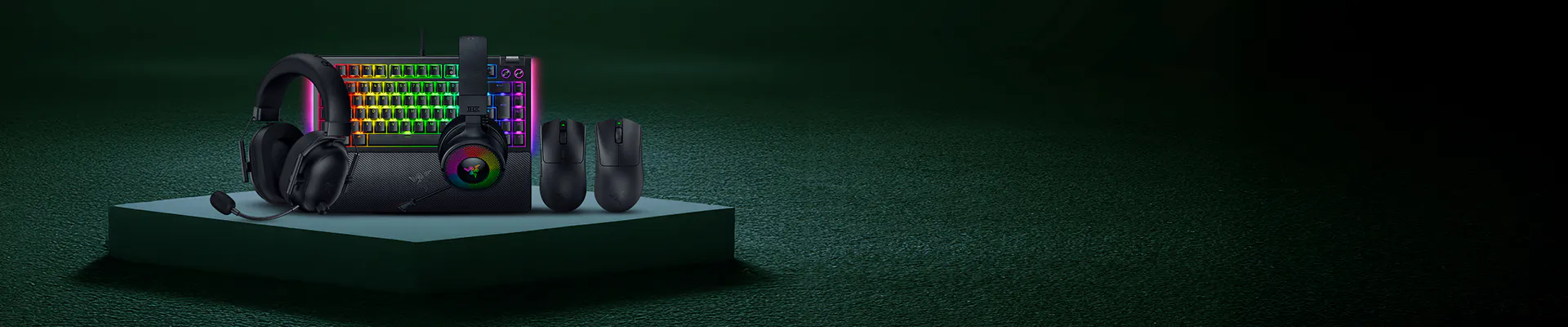 Gaming headset, mouse, keyboard with RGB lighting, and a speaker on a green platform against a dark green background.