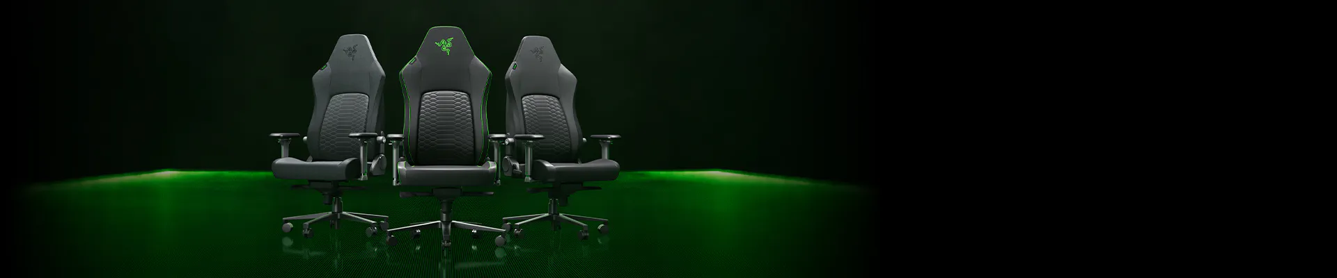 Three black gaming chairs with green accents and logos, set on a green and black digital-themed background.