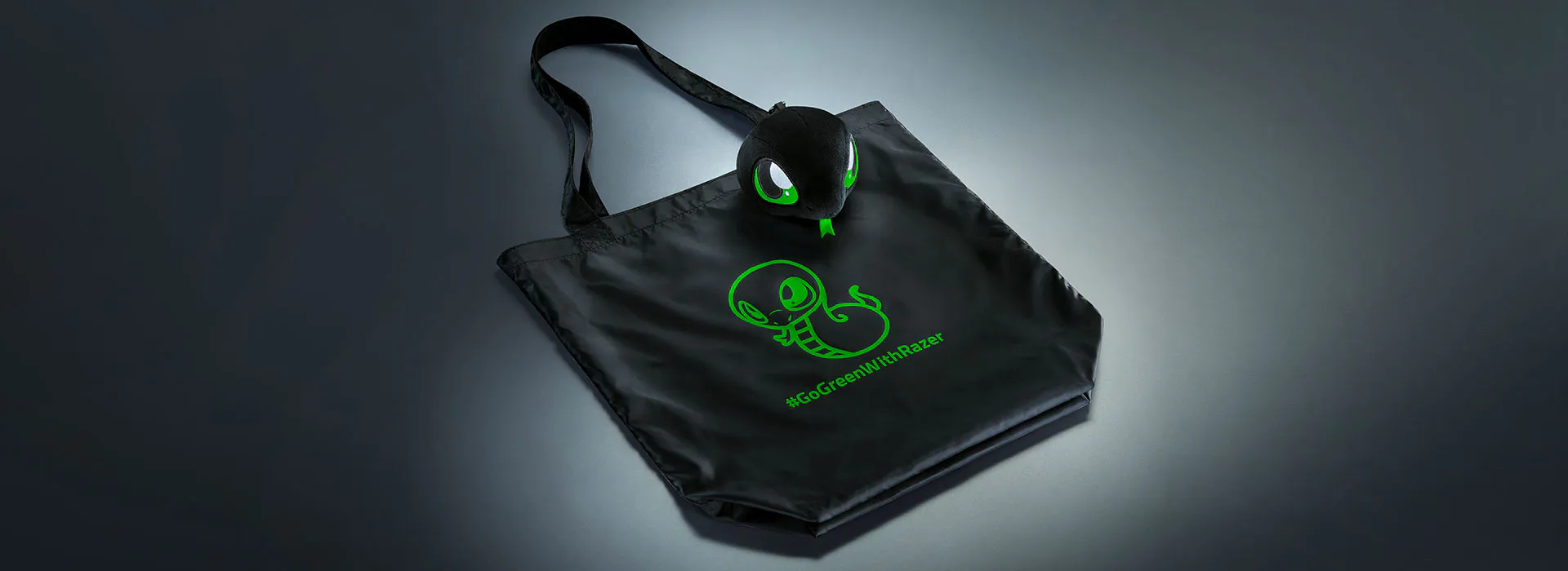 Black Razer Sneki Snek tote bag featuring Sneki Snek artwork and the hashtag “GoGreenWithRazer.
