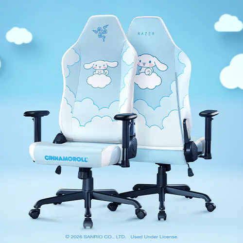 Twin white gaming chairs with cloud and bunny designs, featuring adjustable armrests, black bases with casters, and a blue Sanrio logo.; © 2026 SANRIO CO., LTD. Used Under License.