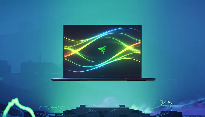 A Razer laptop floats above a futuristic platform with colorful neon light streaks in a dark, tech-inspired environment.