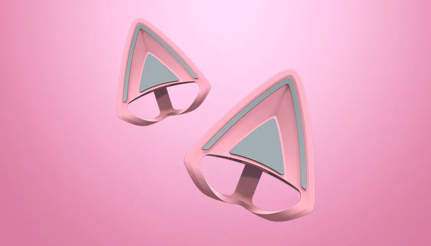 Pink and gray 3D cat ear-shaped objects, possibly wearable or decorative items, against a pink background.