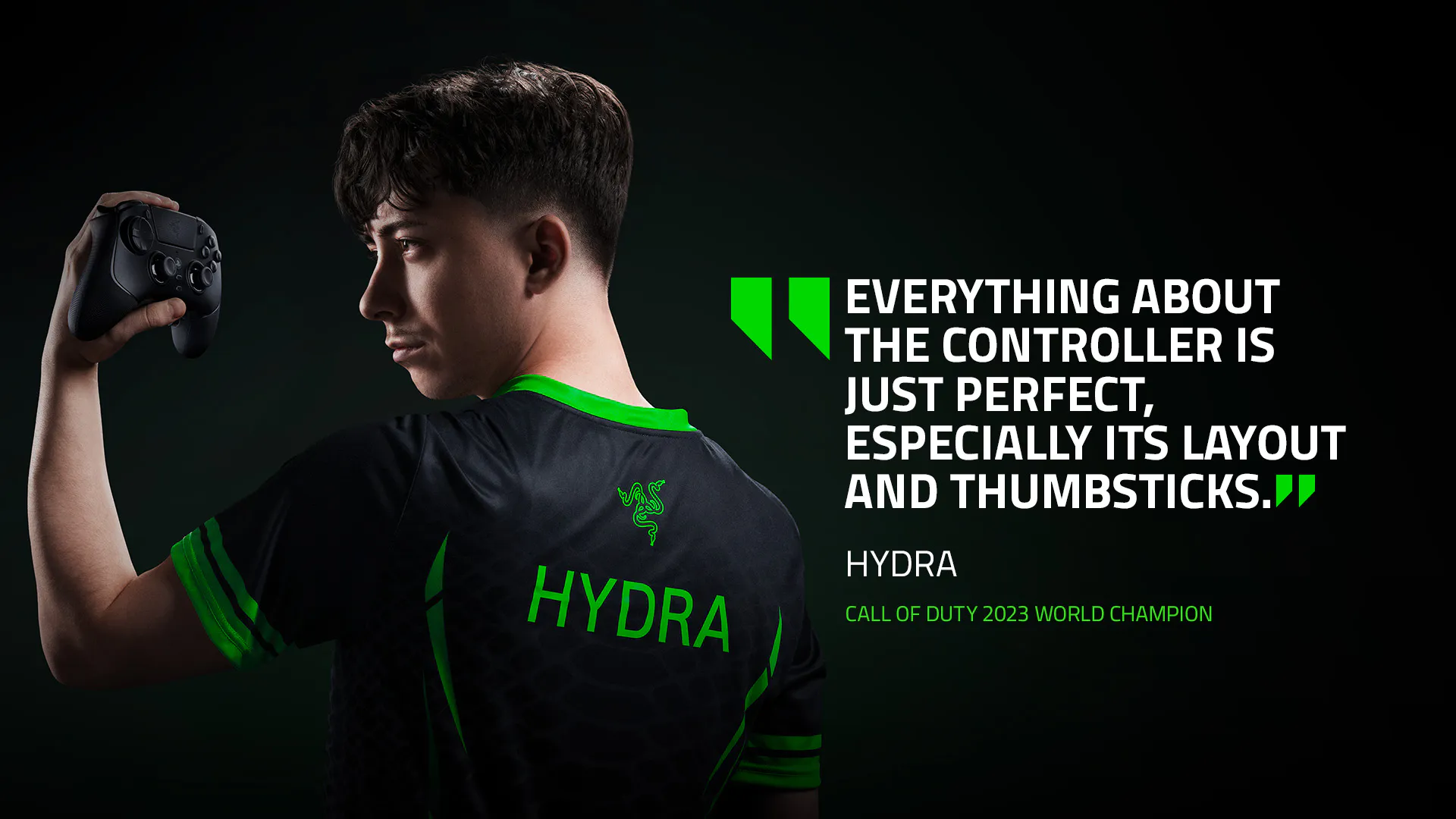 Young man in black and green gaming jersey holding a controller, with a quote about controllers and the "Hydra" Call of Duty 2023 World Champion.