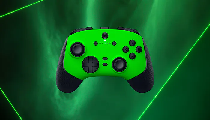 Green and black Razer gaming controller with labeled buttons, three joysticks, and a green background with laser lines.