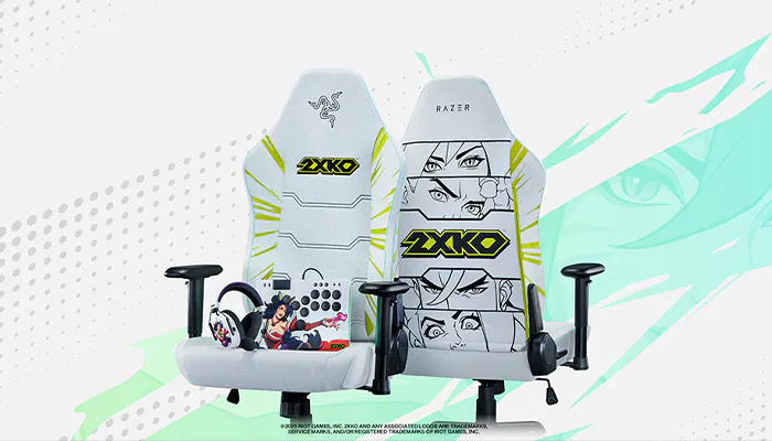 Two gaming chairs with Razer and 2XKO logos, featuring manga-style artwork, one with a character and the other with stylized face sketches.