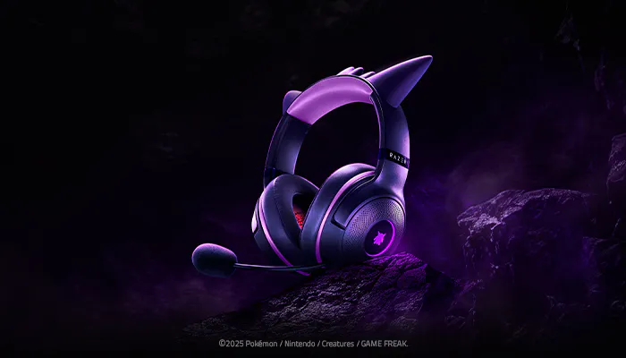 A purple gaming headset with horn-like spikes and a microphone, set against a dark, rugged background, with "RAZER" visible on the headband.