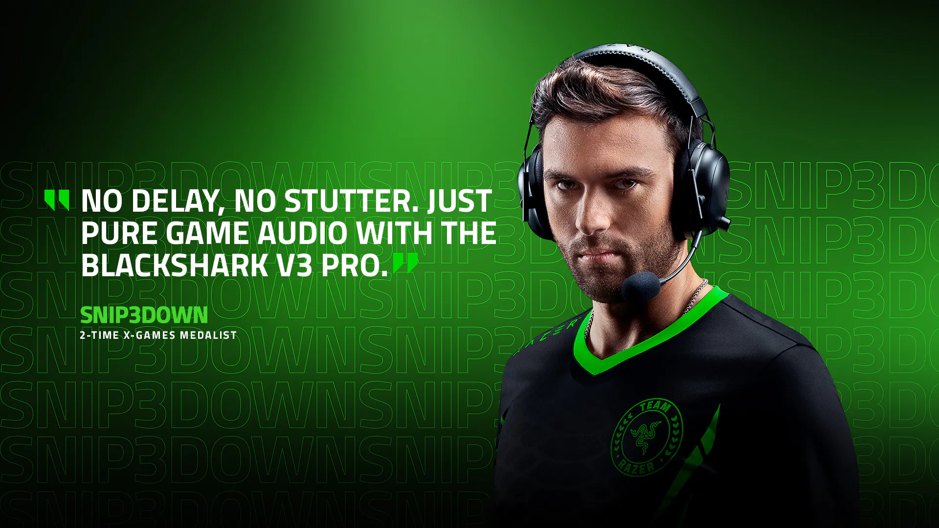 Young man with headset, intense look, wearing black and green team jersey, with background text "SNIP3DOWN" and quote about game audio.| “No delay, no stutter. Just pure game audio with the BlackShark V3 Pro.” | Snip3down | 2-time X-Games Medalist