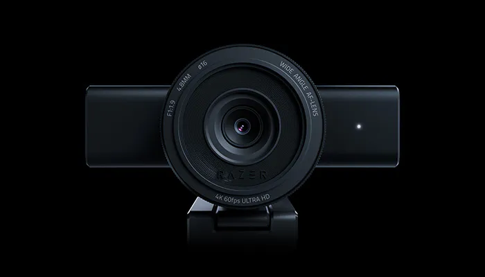 Front view of a black Razer 4K Ultra HD webcam with wide-angle lens, F1.9 aperture, and a small indicator light on the right side.