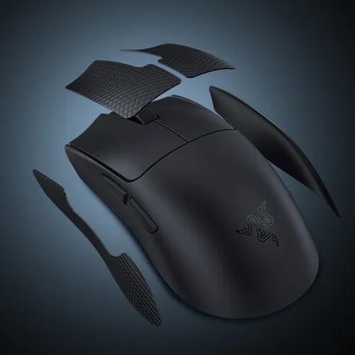 A black Razer gaming mouse with detachable side wings and six textured grips, with carbon fiber-like panels floating above it.