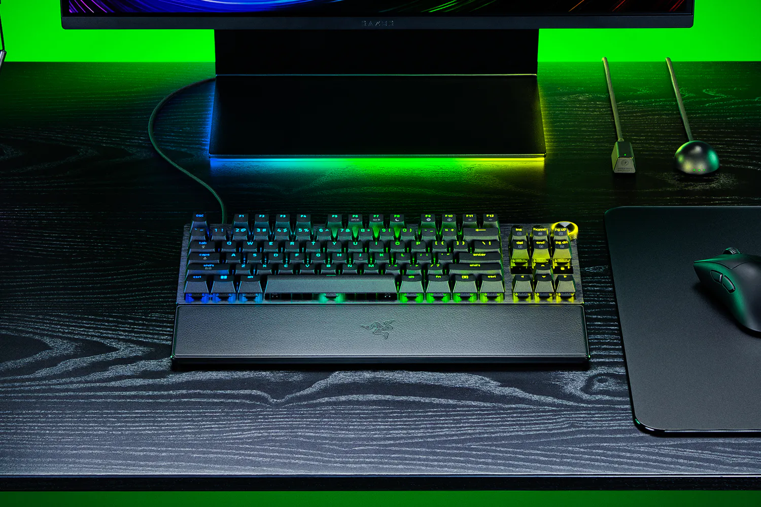 Black Razer Huntsman V3 Pro TKL 8KHz in a desktop setup with its magnetic wrist rest attached
