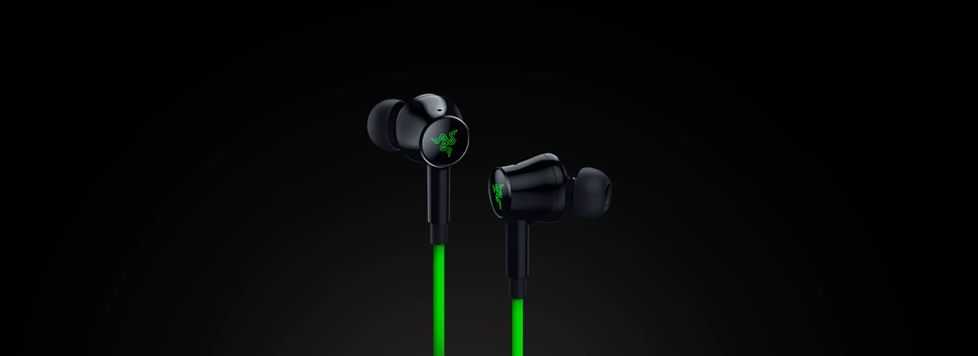 Black Razer earbuds with neon green logo and cable, set against a dark background.
