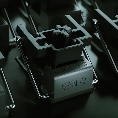 Close-up of a Razer Gen-2 mechanical switch with a black housing, mounted in a tray, on a keyboard with multiple switches.