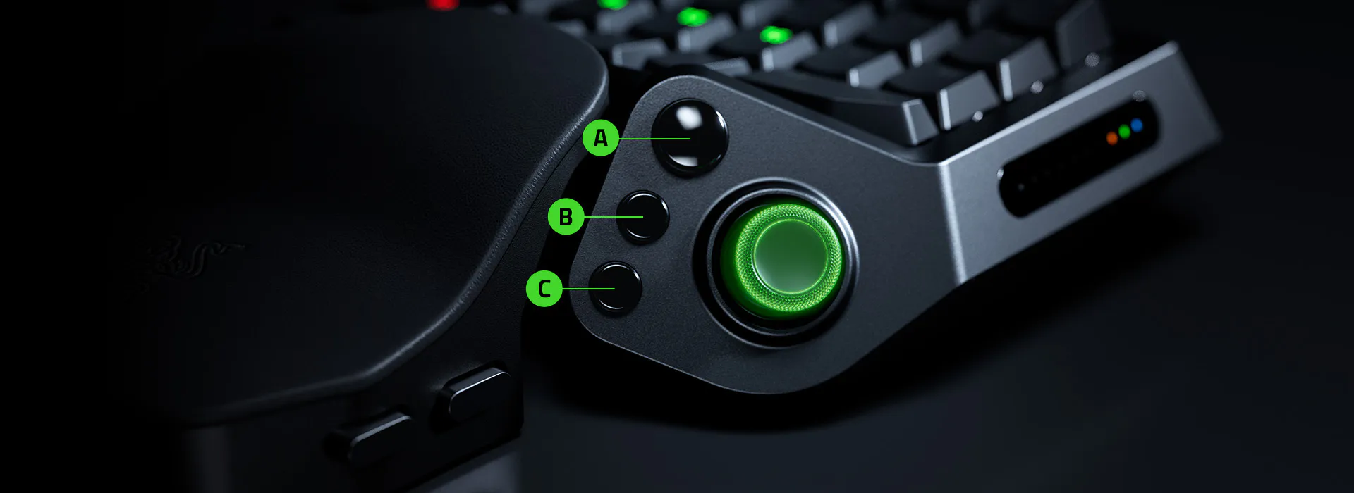 Close-up of a Razer Tartarus V2 Pro with A, B, and C labels pointing to three dedicated buttons on the side.
